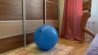 Jumping on a blue balloon