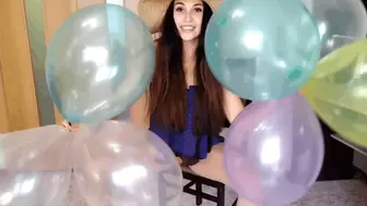 Pops balloons with her ass