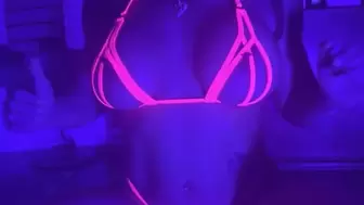 Lucy L'Vette spreading her ass in a pink crotchless pussy harness