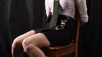 Anne: barefoot police officer, with hands cuffed behind and legs cuffed with leg irons, wiggles on the chair (HD WMV)