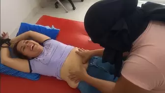 Sian gets her navel tickled by a mysterious masked woman
