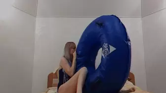 Alla is blowing up a huge inflatable ring for a water park with her mouth!!!
