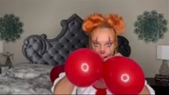 Sexy Clown Blowing Up a Bunch of Balloons