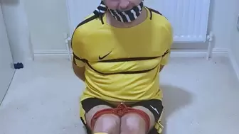 Footballer in yellow and black kit struggling to get out of tight bondage 1-BBW domination,BBW bondage,male bondage,man tied up,man in bondage,football kit,soccer kit,bound and gagged man, amateur,gay bondage,socks,