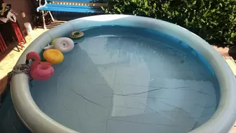 Floating and bouncing in a pool outdoors