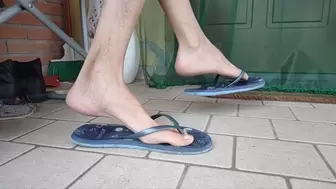 Dangling and shoeplay with female flip flops and sandals - foot massage