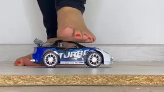Ashley crushes toy car and plastic bottles with her feet