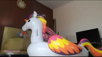 Lia pops her unicorn
