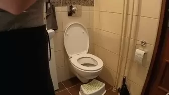 Sitting side on a toilet