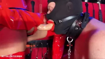 Evilwoman penetrates slave ass in red latex