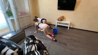 sexy housekeepers cleaning the floor
