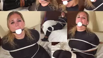 MP4 Full Screen Format " Anna the new housewife " gagged with her own big ball gag and roped and strapped in cat suit and boots"