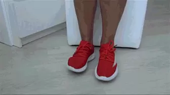 Toe wiggling in red sneakers a