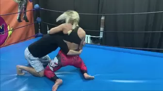 Blonde with biceps in red leggins wrestles