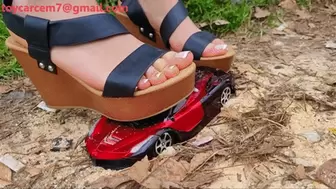 Wooden sandals obliterate toy car