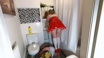 Sexy Nurse Brushes Her Hair In The Mirror Whilst Standing On Her Slaves Head