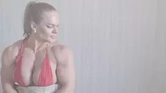 Muscle barbie with ponytail in sexy red bikini top
