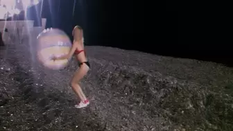 Alla plays with a big transparent beach ball on the night beach!!!