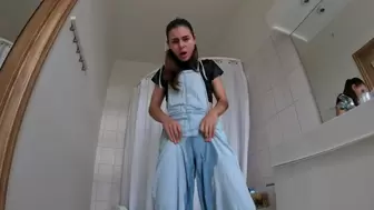 Desperate peeing in jeans overalls