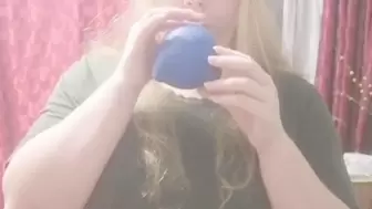 19 year old naked girl with big boobs blowing up a balloon