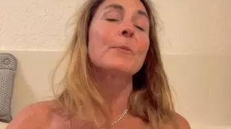 Carissa tries out her "new" vintage mask in the tub-nude