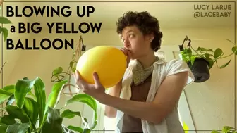 Blowing Up A Big Yellow Balloon