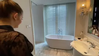 Busty blonde rubs her pussy in the bathtub