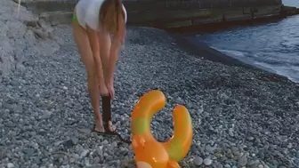 Alla found an abandoned inflatable ring on the beach and decided to destroy it with a hand pump!!!
