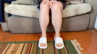 bare feet in white slippers