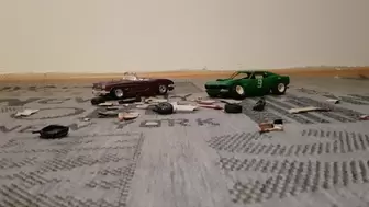 Two model cars crushed
