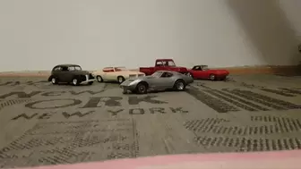 Model car crushed with socked feet