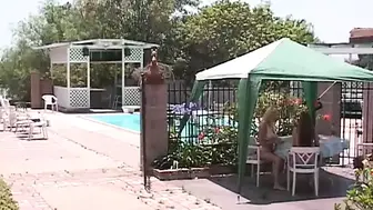 Blonde chick blows her friend's nipples and pussy outside by pool